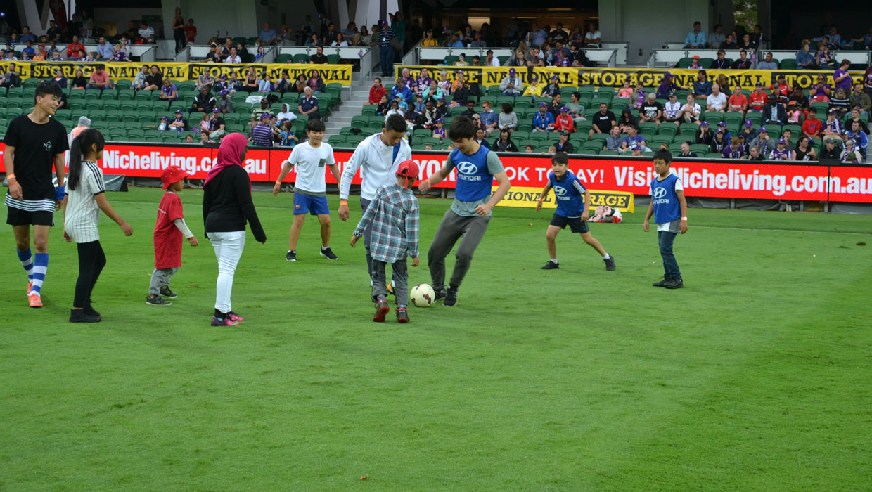 Save the Children on the pitch playing